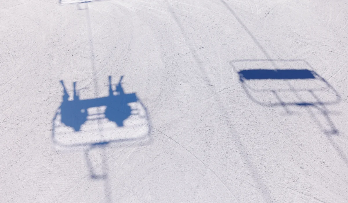 chairlift shadows on snow