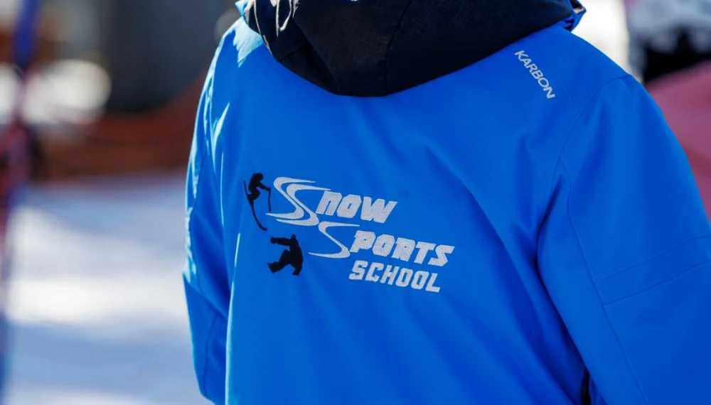 Snow Sports School blue jacket