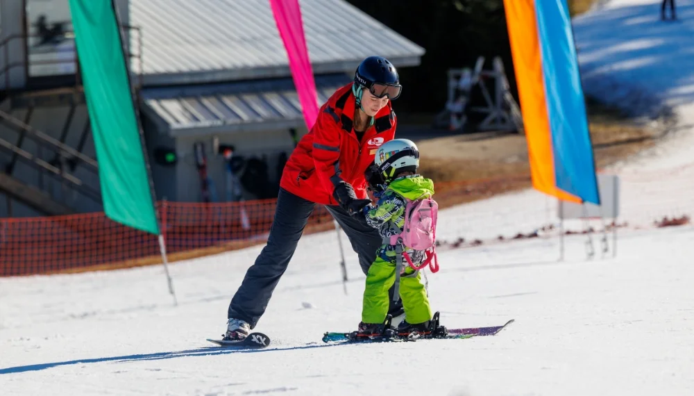 child learning to ski