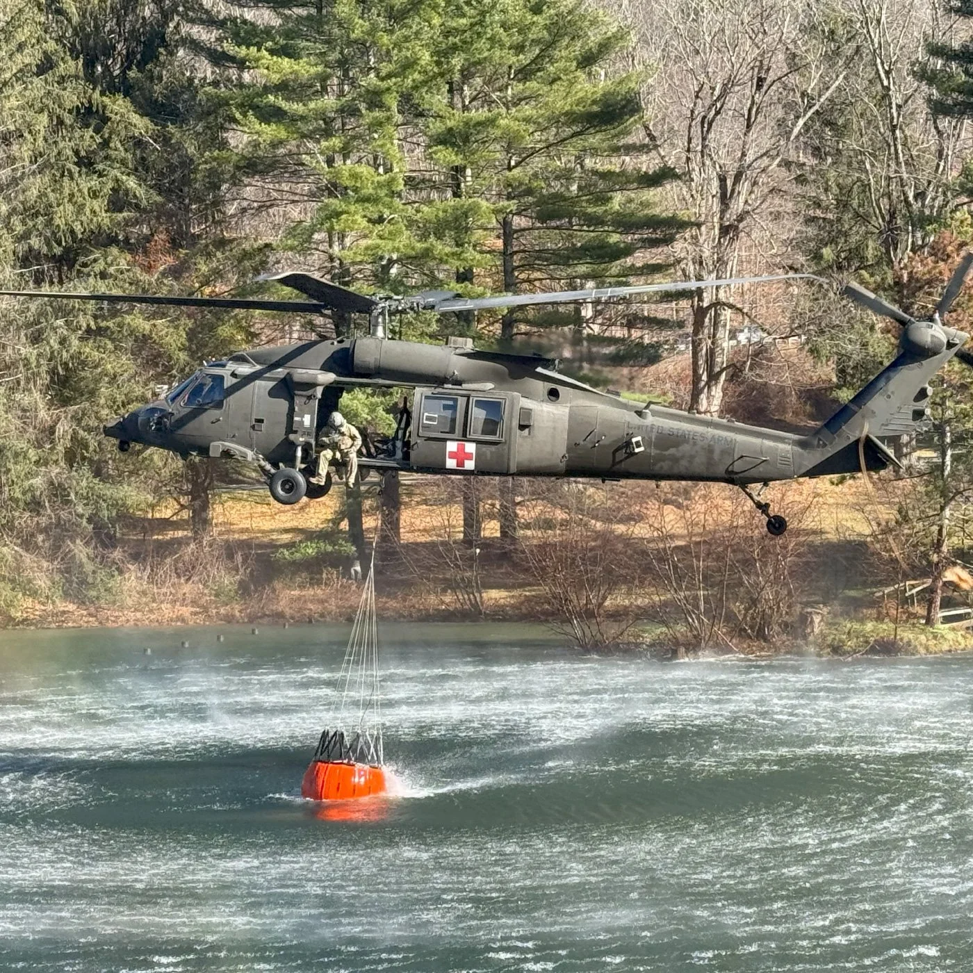 fire rescue helicopter filling water bucket