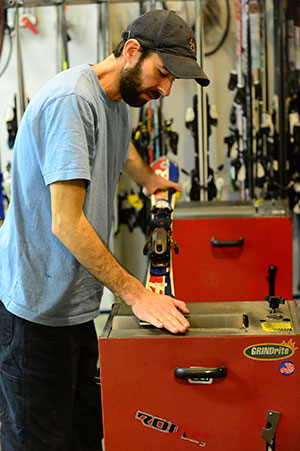 Technician adjusting a binding.